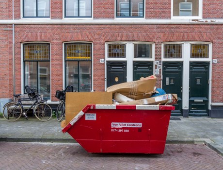 Small skip and van outside a terraced house in Tufnell Park