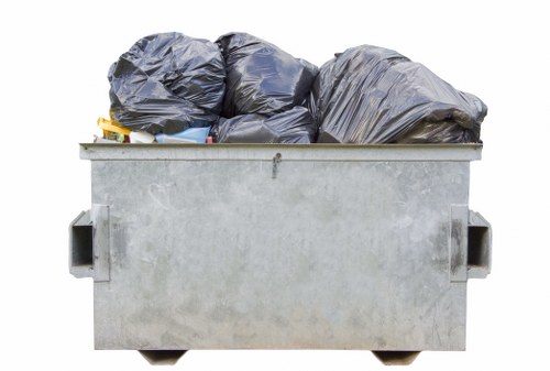 Happy customer loading skip with waste