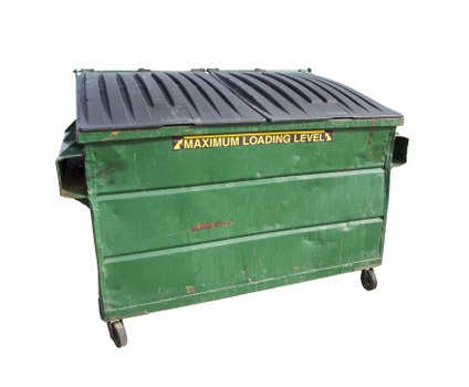 Builders placing a skip on their worksite