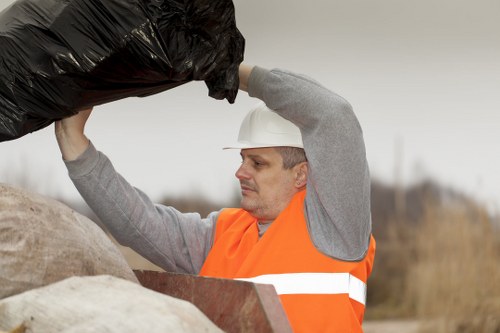 Recycling materials being loaded into a skip